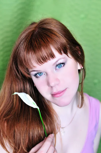 Redheaded girl with white flower — Stock Photo, Image