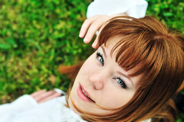 Girl laying on the spring meadow — Stock Photo, Image