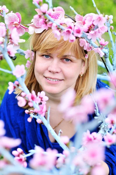 stock image Woman in spring blossom garden