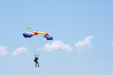 Parachuter and clouds clipart