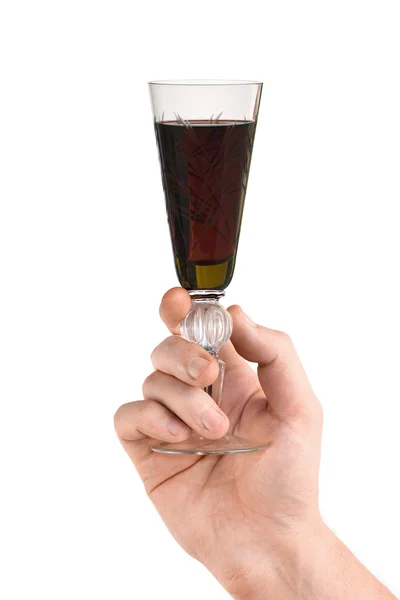 Hand met glas rode wijn — Stockfoto