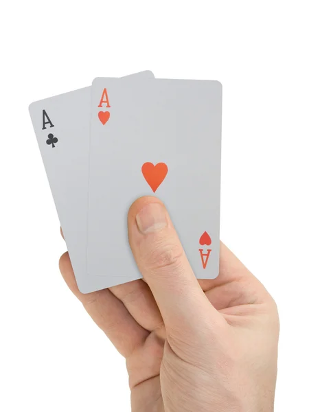 Χέρι με τις κάρτες παιχνιδιού (δύο άσους), που απομονώνονται σε λευκό — Φωτογραφία Αρχείου