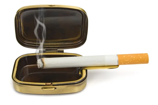 Smoking cigarette in compact ashtray — Stock Photo, Image
