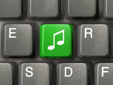 Computer keyboard with music key clipart
