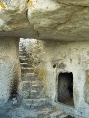 Stairs in stony cave house clipart