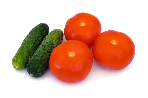 Komkommers en tomaten — Stockfoto