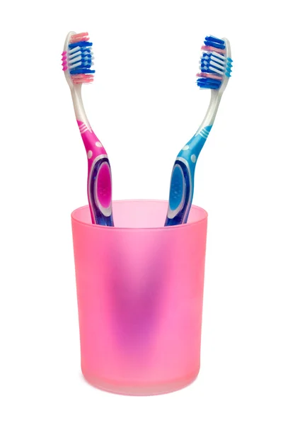 Зубні щітки в чашці — стокове фото