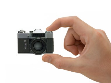 Super compact camera in hand clipart