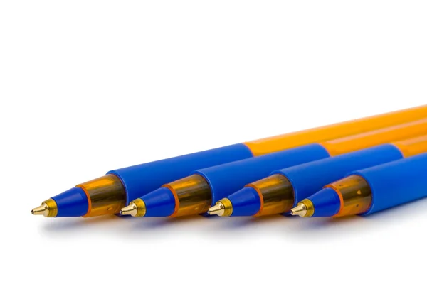 Четыре ручки, крупный план — стоковое фото