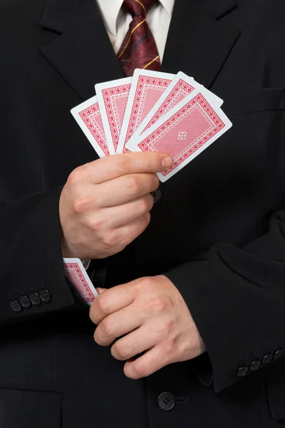 Hands and card in sleeve — Stock Photo, Image