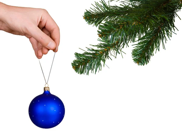 Cristmas strom, ruka a míček — Stock fotografie