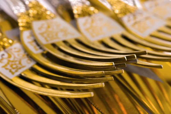 Macro of golden forks — Stock Photo, Image