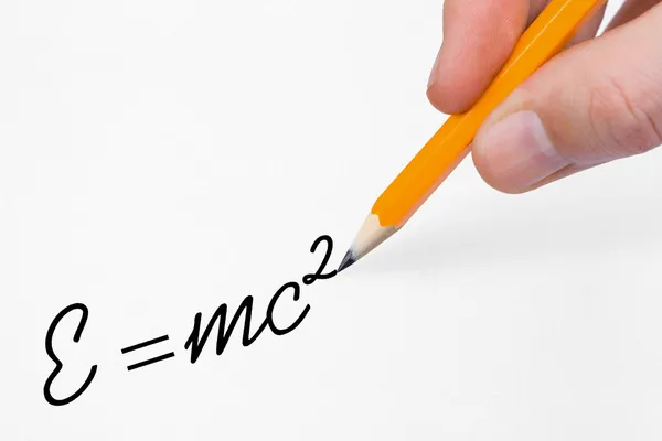 Hand writing formula on paper — Stock Photo, Image