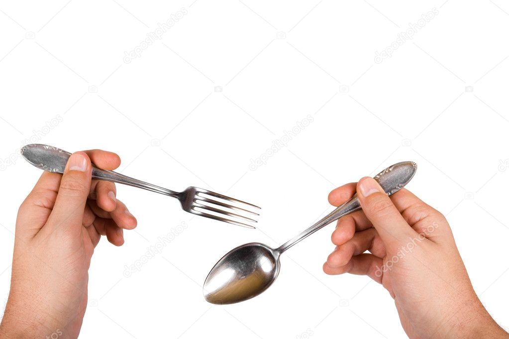 Fork and spoon in hands