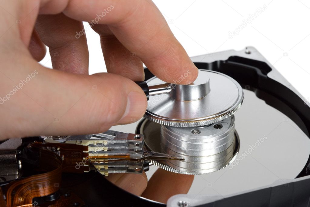 Hand with stethoscope and computer hard drive