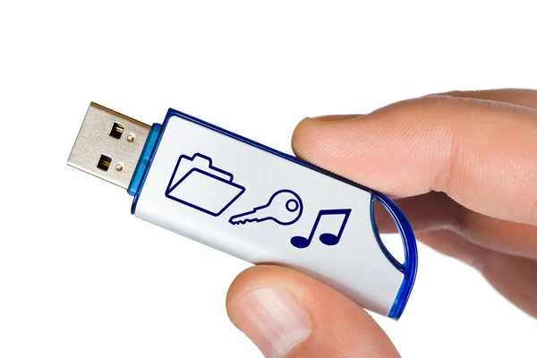 Flash drive with symbols in hand — Stock Photo, Image