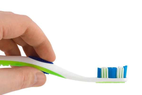 Mano con cepillo de dientes — Foto de Stock