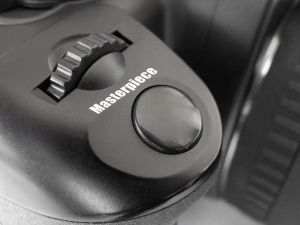 Button Masterpiece on photo camera — Stock Photo, Image
