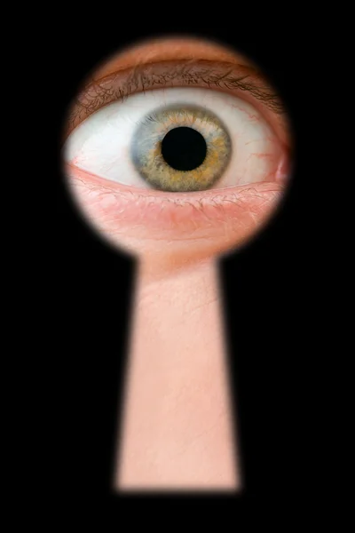 Eye in keyhole — Stock Photo, Image