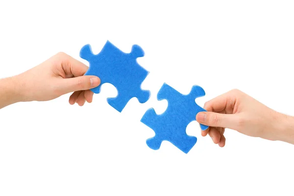 Ruce a puzzle — Stock fotografie