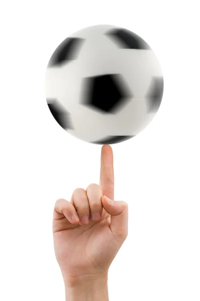 Mano y balón de fútbol giratorio — Foto de Stock