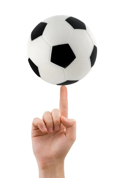 Mão e bola de futebol girando — Fotografia de Stock