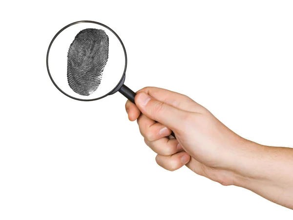 Magnifying glass in hand and fingerprint — Stock Photo, Image