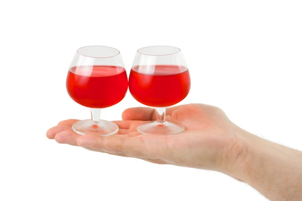 Hand and wineglasses — Stock Photo, Image