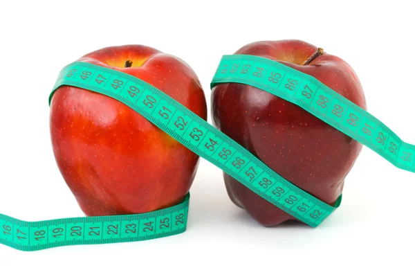 Jabłka i taśma pomiarowa — Zdjęcie stockowe