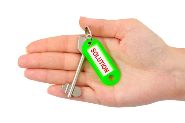 Mão e chave com etiqueta Solução — Fotografia de Stock