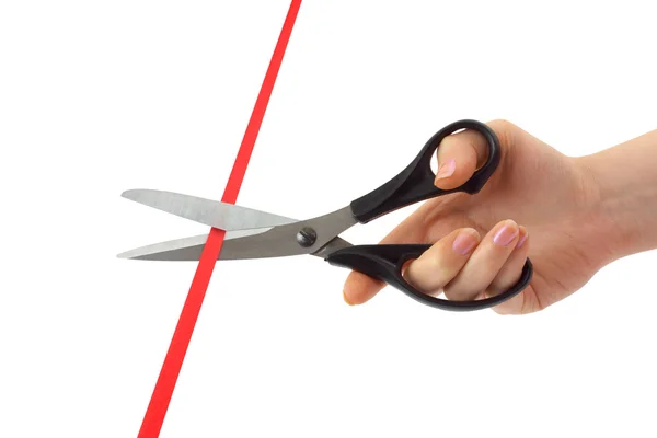Hand with scissors and ribbon — Stock Photo, Image