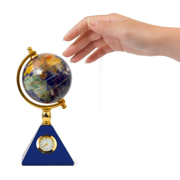 Hand and spinning globe — Stock Photo, Image