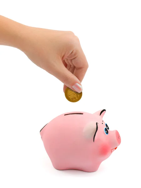 Piggy bank and hand with coin — Stock Photo, Image