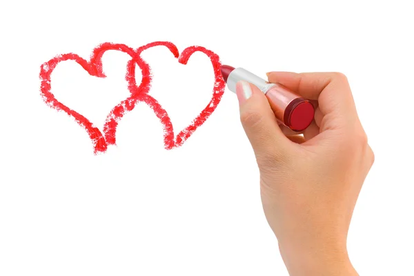 Hand with lipstick drawing hearts — Stockfoto