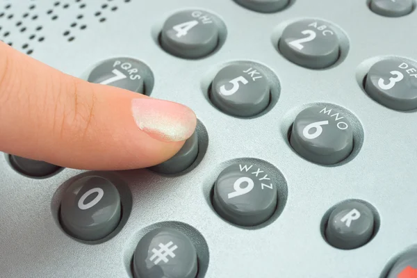 stock image Phone keypad and woman finger