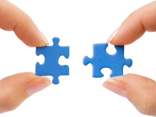 Handen en puzzelabstracte blauwe achtergrond voor uitnodiging — Stockfoto
