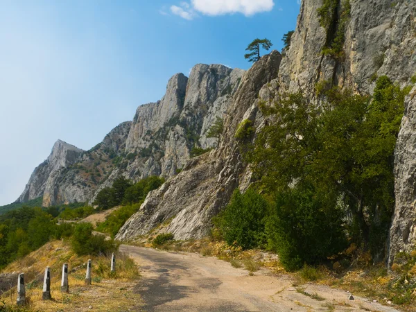 Old road in mountains — Stock Photo, Image