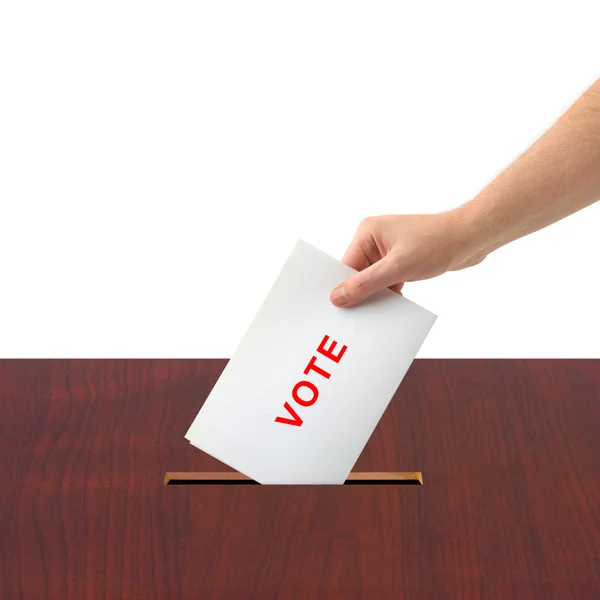 Main avec bulletin de vote et urne — Photo