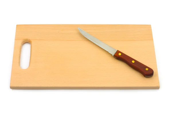 Нож и доска для рубки — стоковое фото