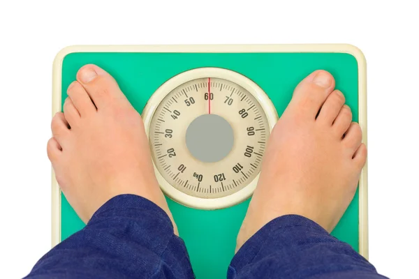 Kadın ayakları ve ağırlık ölçeği — Stok fotoğraf
