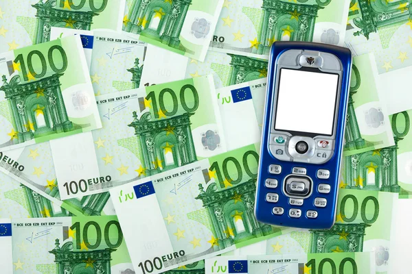 Mobiele telefoon op geld achtergrond — Stockfoto