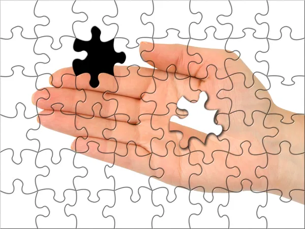 Puzzle hand without one piece — Stock Photo, Image