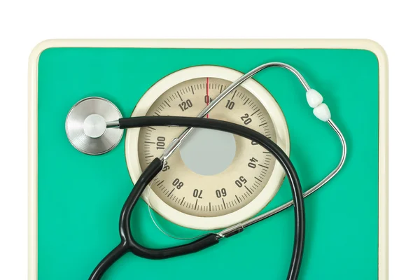Stethoscope on weight scale — Stock Photo, Image