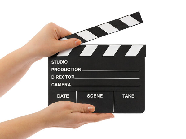 Cinema clapboard in hands isolated on white background