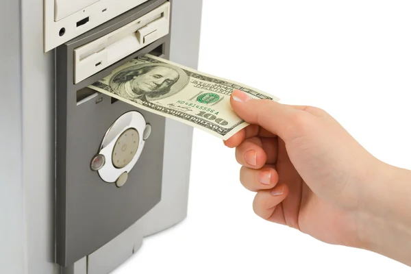 Hand met geld en computer — Stockfoto