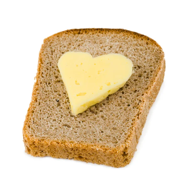 Brot und herzförmiger Käse — Stockfoto