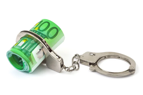 Money and handcuffs — Stockfoto