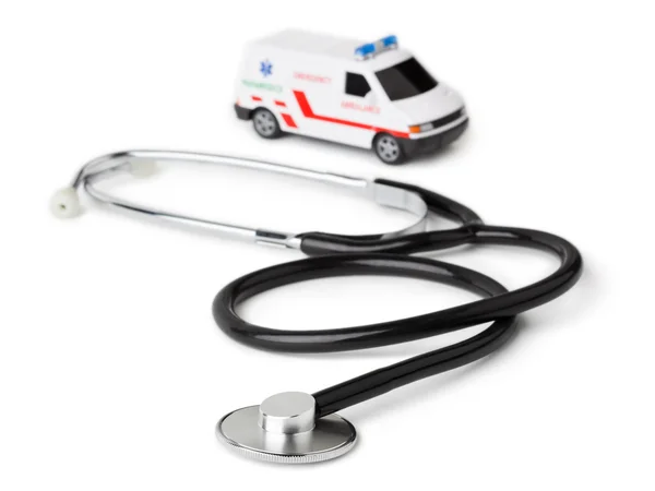 Stetoskop och leksak ambulans bil — Stockfoto