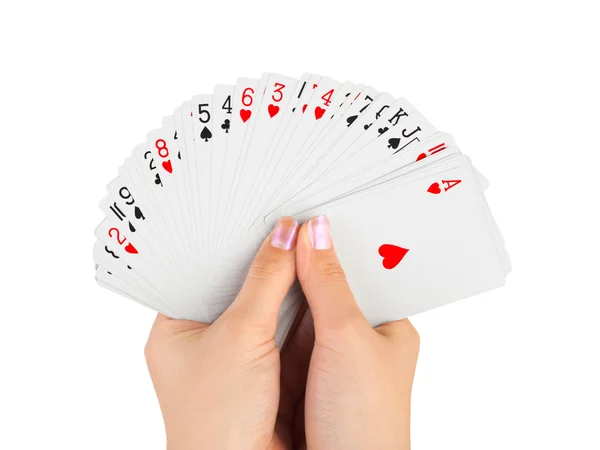 Händer och spelkort — Stockfoto