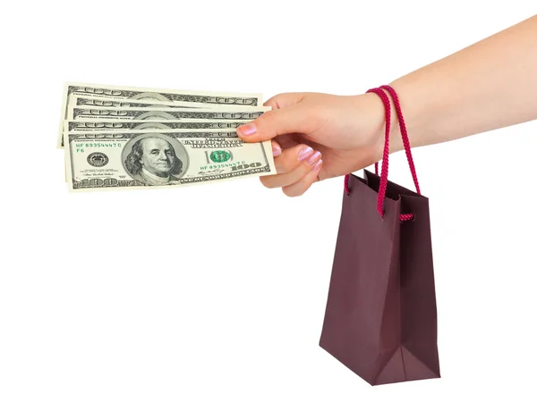 Mano con soldi shopping bag — Foto Stock